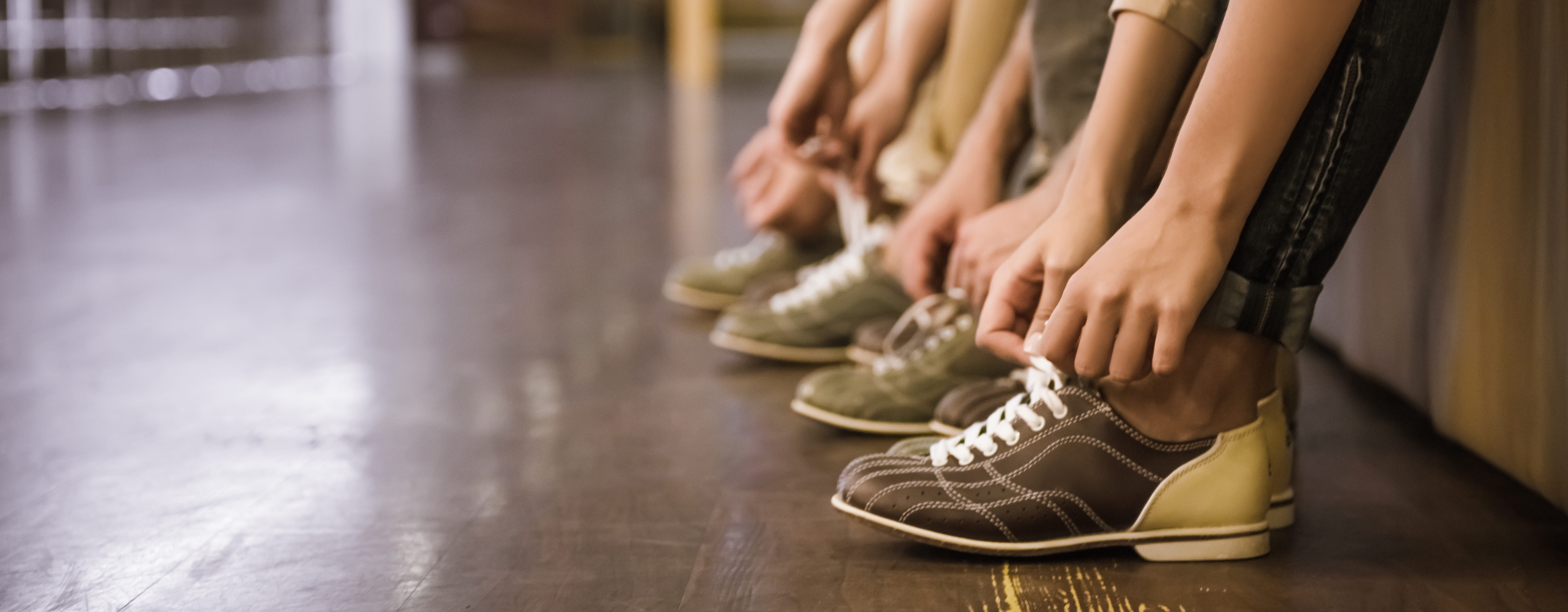 Putting on bowling shoes